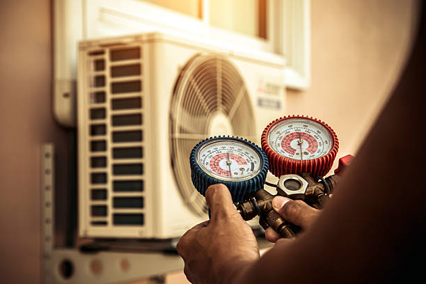 Professional Air Conditioning Service technician working in Fresh Meadows, NY